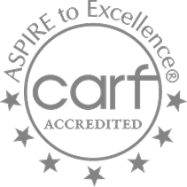 CARF accreditation logo with stars.