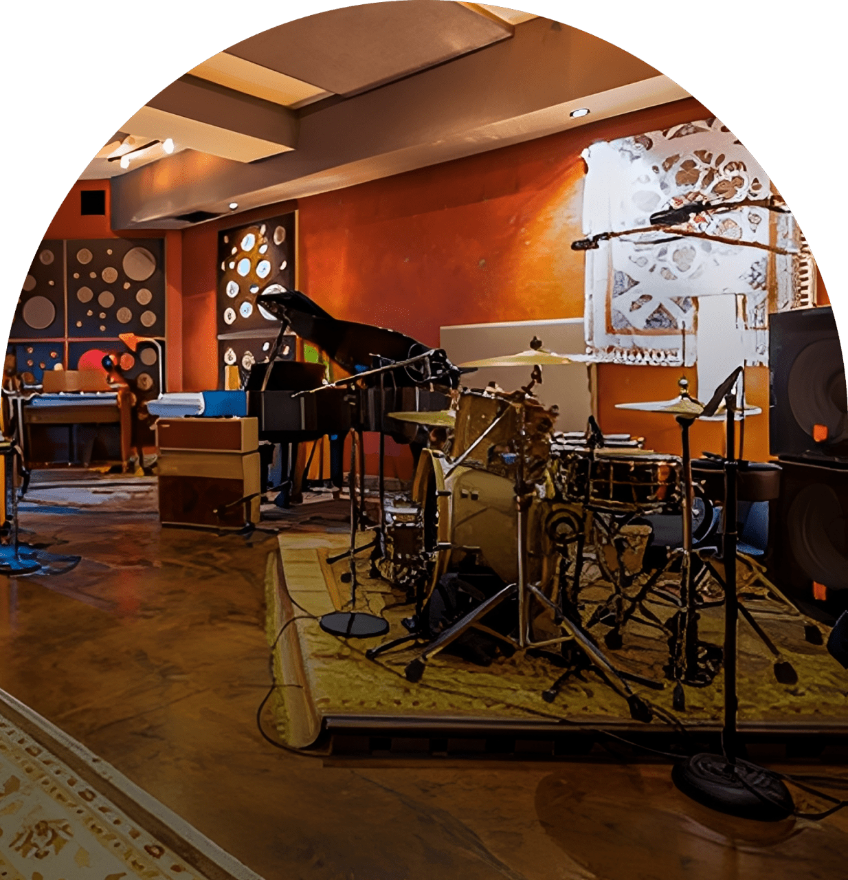 Music studio with drum set and piano.