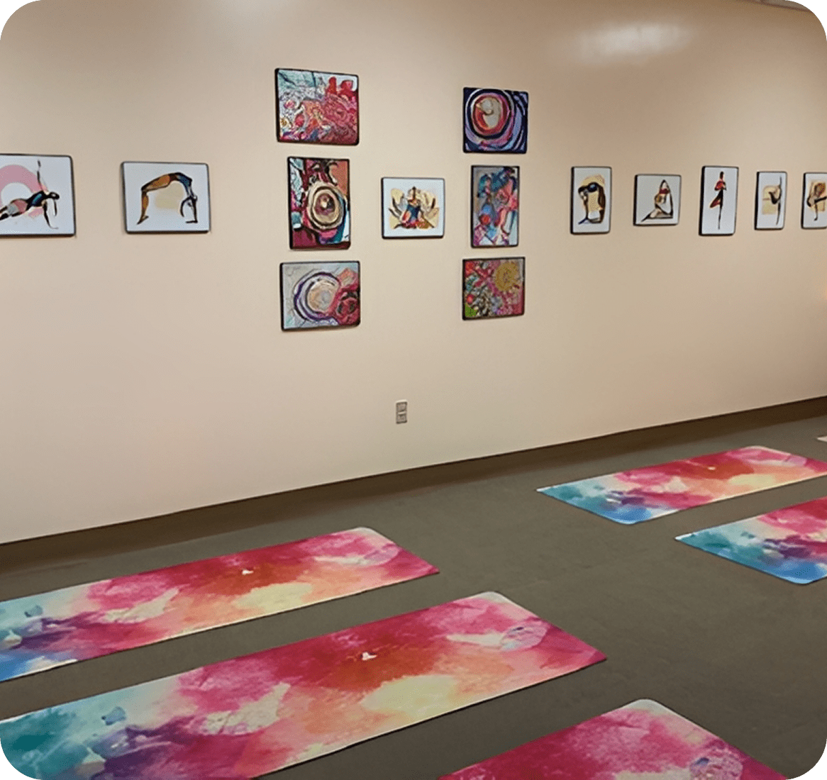 Colorful yoga studio with wall art.