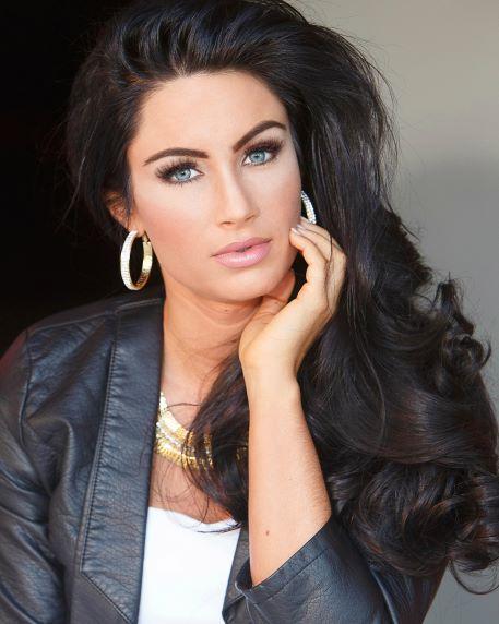 Woman with long hair and hoop earrings.