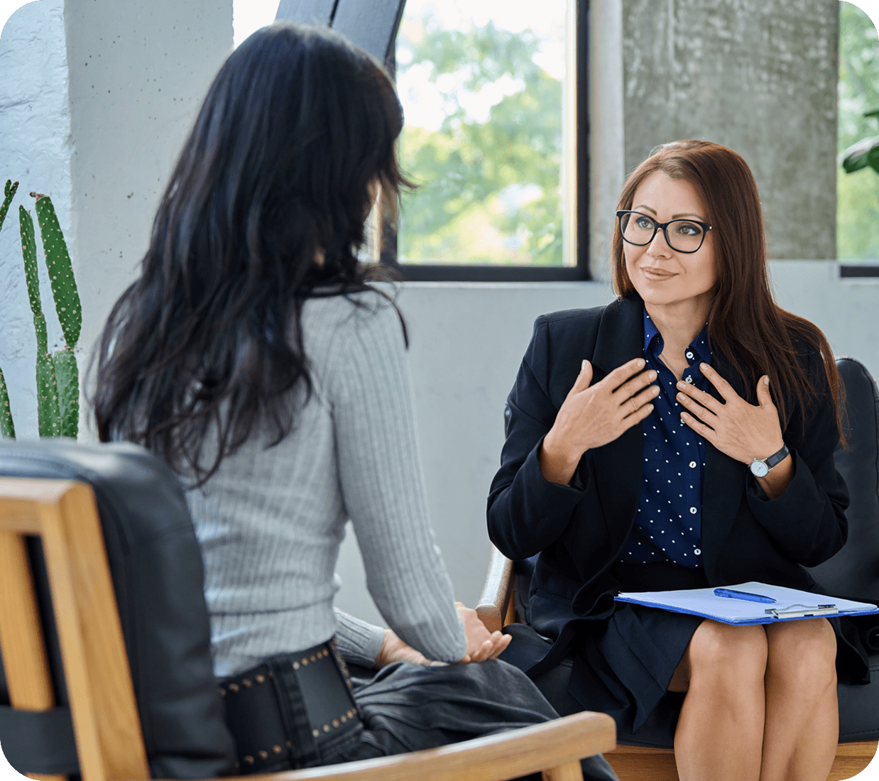 Two women having a professional conversation indoors.