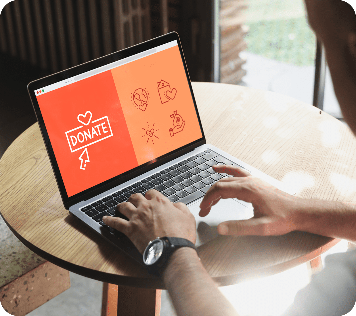 Person using laptop with donate screen.