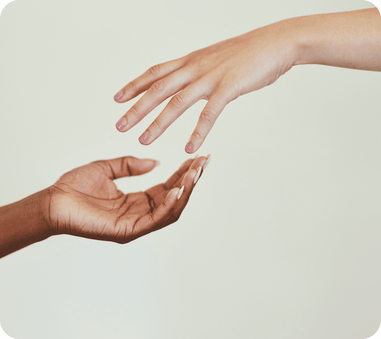 Reaching hands symbolizing connection and support.