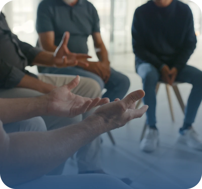 People sitting in a discussion circle.